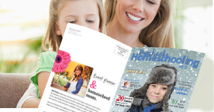 Mother and daughter reading a magazine on the couch